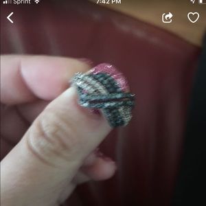 Blue diamond crossed ring